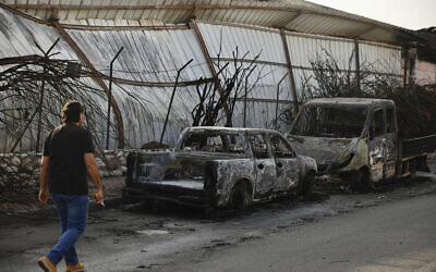 Burnt cars sit after a Tuesday's rocket firing from Gaza, in Sderot, southern Israel, Wednesday, Nov. 13, 2019. Gaza officials say new Israel airstrikes have killed a few militants. (AP Photo/Ariel Schalit)