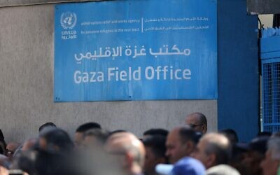 Protesters are seen during a demonstration outside the Gaza City headquarters of the United Nations Relief and Works Agency (UNRWA) for Palestine Refugees.