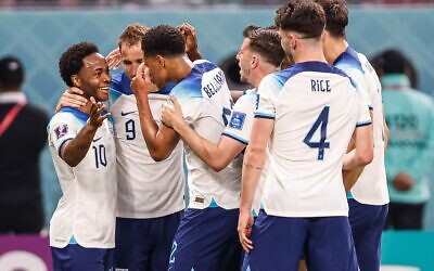 England celebrates after scoring during a match between England and Iran.