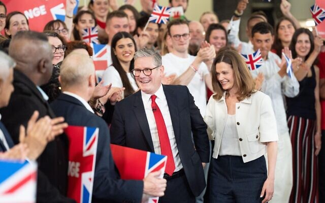 Labour leader Sir Keir Starmer and his wife Victoria Starmer are cheered at a watch party for the results of the 2024 General Election in central London.