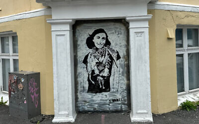 A mural of Anne Frank wearing a keffiyeh in Bergen, Norway, painted by the anonymous artist Töddel, July 2024. (Courtesy of Töddel)