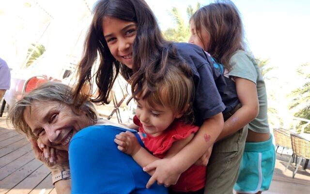 Adele Raemer and her grandchildren