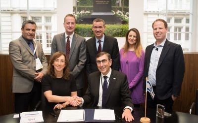 Signing the memorandum of understanding. 

Back left-right: Nathan Tor of the Embassy of Israel, UK Ambassador to Israel David Quarrey, Israeli envoy to Britain Mark Regev, Paloma Cid of IET , Hugo Bieber, Chief Executive, UK Israel Business. Front: Karin Mayer-Rubinstein (IATI) and Nigel Fine (IET)

Photo credit: Blake Ezra Photography