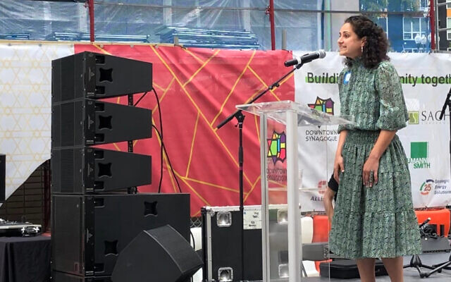 Samantha Woll, president of the Isaac Agree Downtown Synagogue in Detroit, welcomes attendees to the congregation's centennial celebration and groundbreaking on a major renovation project, Aug. 14, 2022. (Andrew Lapin)