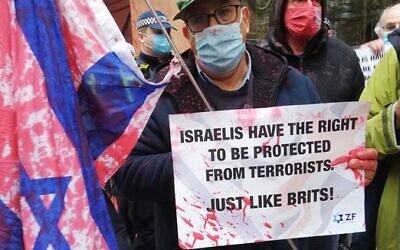 Pro-Israel activist Jonathan Hoffman with his red-stained Israel flag at the counter-demonstration