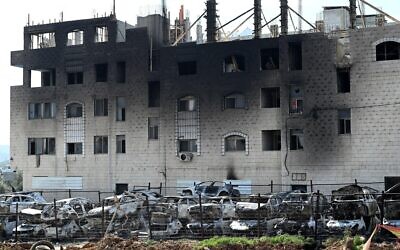 2NRNC57 Hawara, Gaza. 27th Feb, 2023. A view of a building and cars burned by Israeli settlers in a revenge attack after two Israeli brothers were killed yesterday by a Palestinian gunman in Hawara, in the West Bank, on Monday, February 27, 2023. Photo by Debbie Hill/ Credit: UPI/Alamy Live News