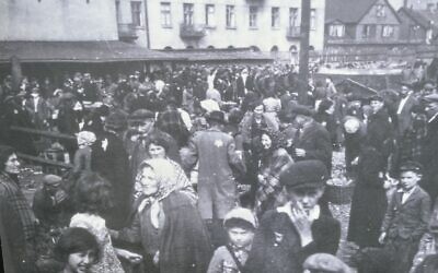 Lodz Ghetto memorial photograph, showing Zigi Shipper, foreground, touching his hand to his face. Pic: Darren Richman