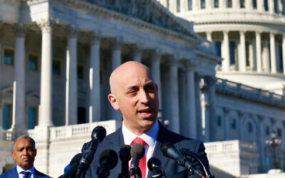 ADL CEO Jonathan Greenblatt, at podium, joining District of Columbia Attorney General Karl Racine, at left, in filing a lawsuit against the groups that allegedly organized the insurrection at the Capitol, speaks at a press conference at the U.S. Capitol, Dec. 14, 2021. (Ralph Alswang)