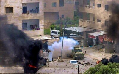 Israeli military vehicle caught in Jenin, West Bank.