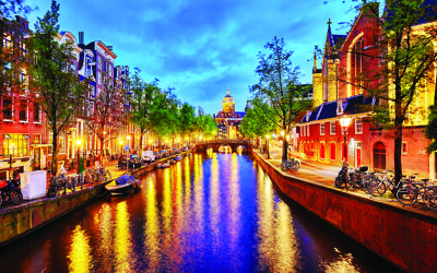 Westerkerk (Western Church), with water canal view in Amsterdam. Netherlands.