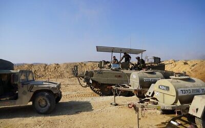 Israeli troops on the Gaza side of the border at the entrance to a tunnel.